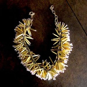 Gold with pink details. Only worn a few times.